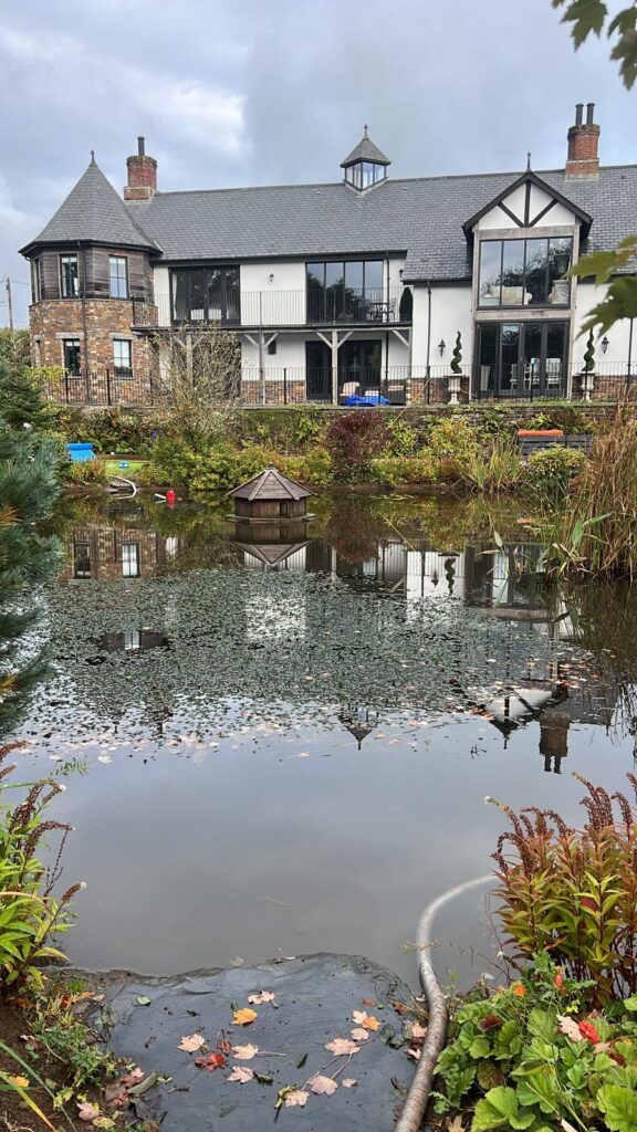 Sasaquatics pond maintenance team cleaning pond in Cornwall