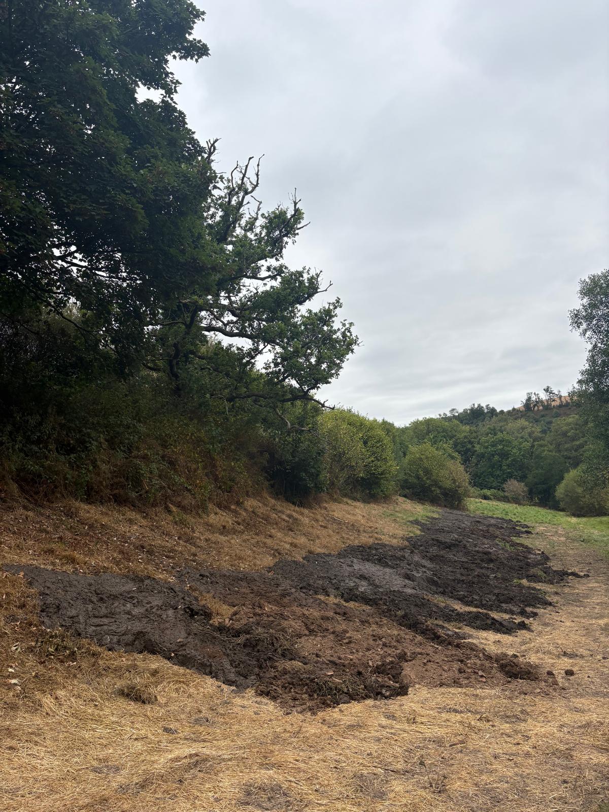 Excavated pond silt placed in an agreed on-site area for drying and later management